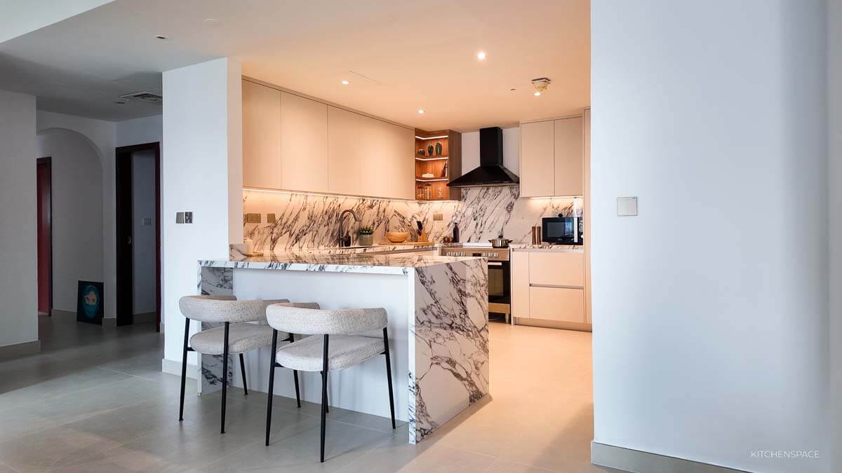 Open-Concept Marble Waterfall Kitchen